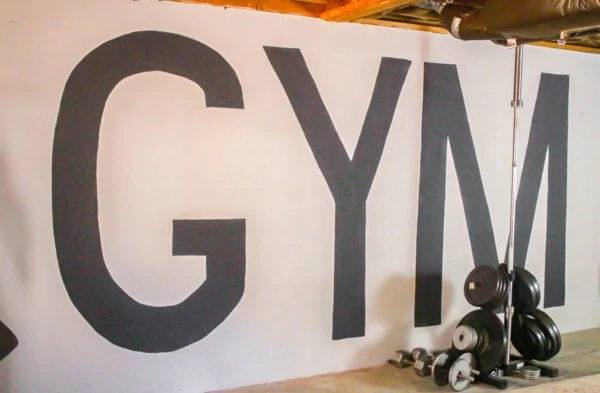 huge letters spelling gym painted on wall.