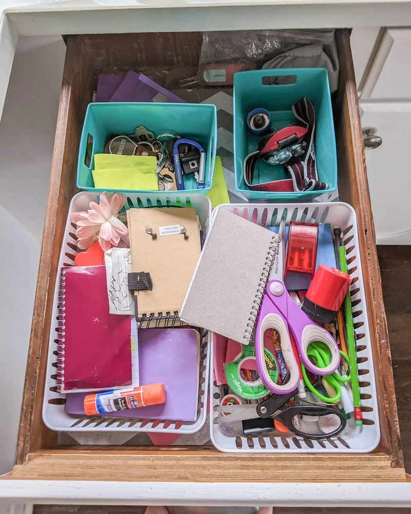 messy junk drawer in need of organization.