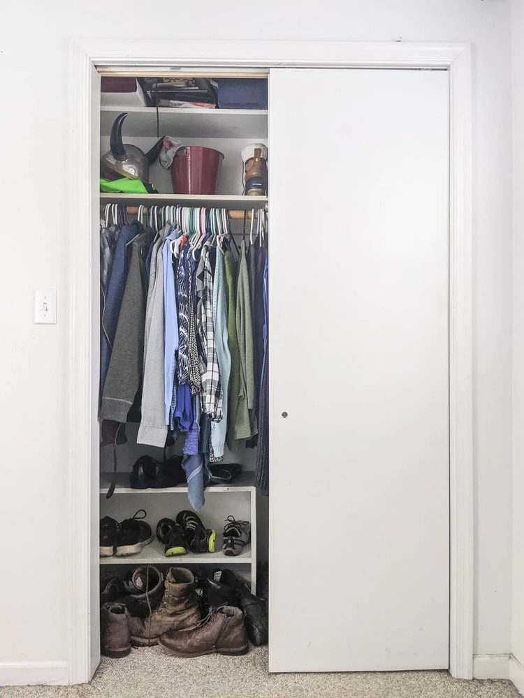 small closet with sliding closet doors with one door open