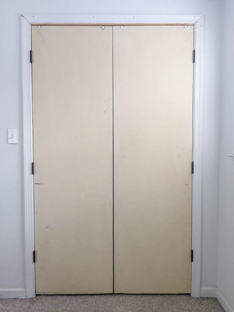 old sliding closet doors rehung with hinges.