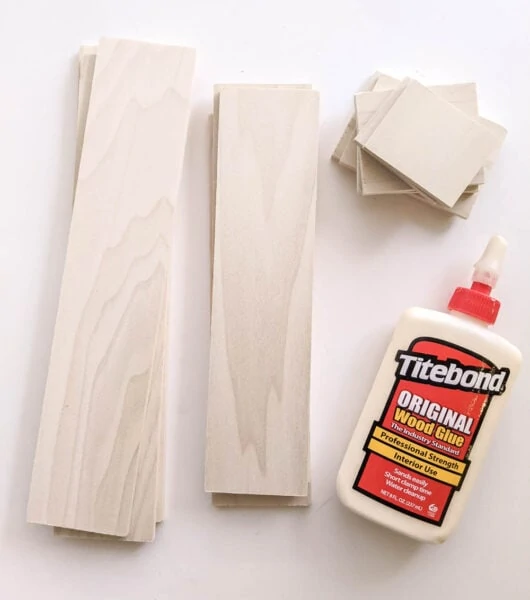 Wood glue and wood cut to size for drawer dividers.