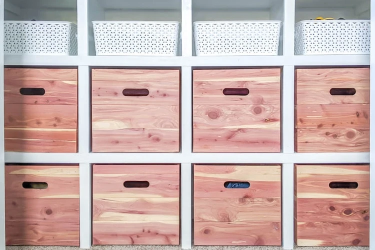 DIY closet shelves made from MDF with DIY cedar storage boxes.