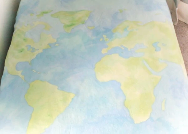 world map painted on duvet cover.