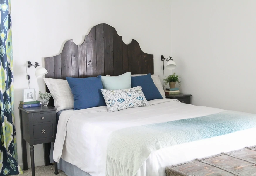 diy curvy wood plank headboard in bedroom. 