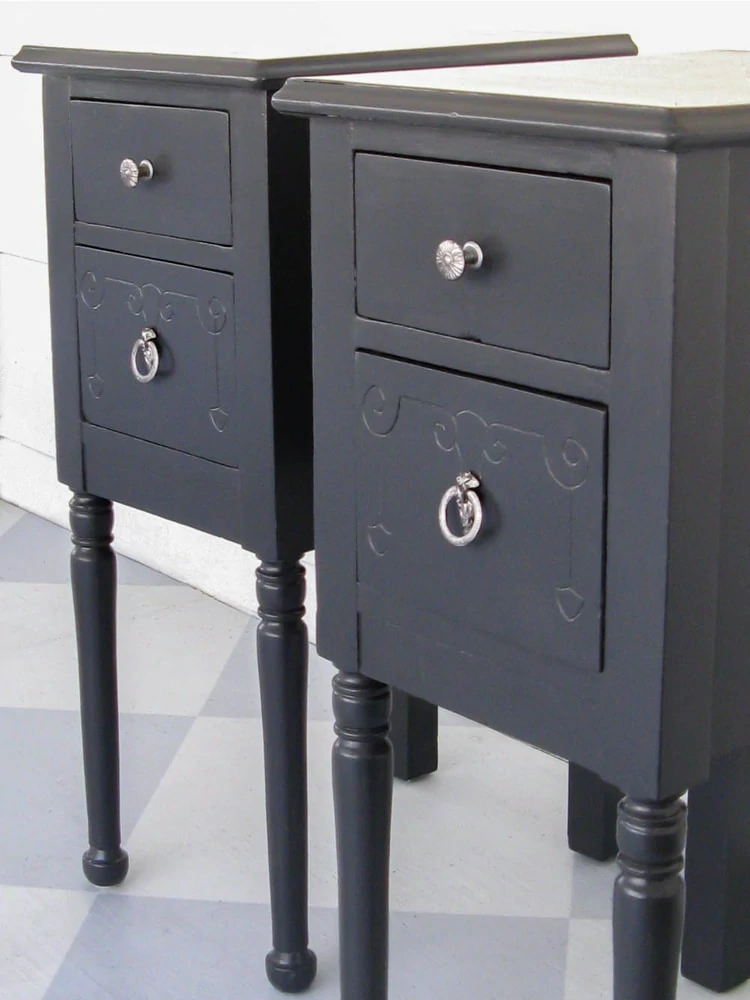 pair of nightstands painted dark grayish blue.