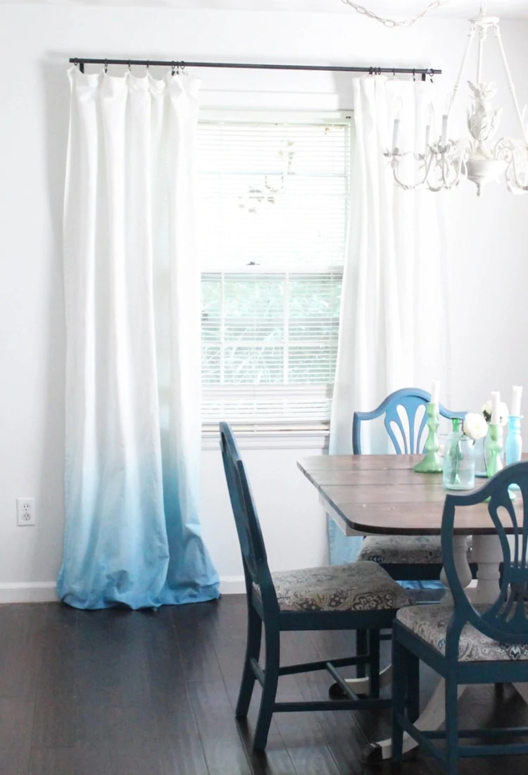 diy blue ombre curtains hanging on window in dining room.