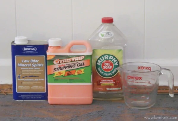 Preparing to test methods for removing glued-down carpet - Murphy's soap, mineral spirits, citristrip, and boiling water.