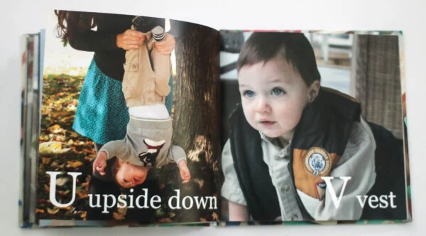 abc photo book with u for upside down and v for vest.