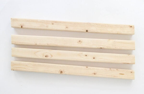 Four 2x2 pieces of wood with a five degree angle at each end to make the corners of the planter box.