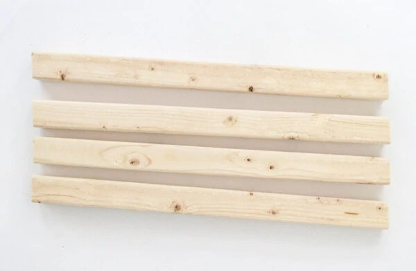 Four 2x2 pieces of wood with a five degree angle at each end to make the corners of the planter box.