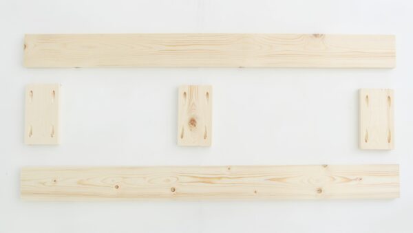 pine boards cut to make diy wood shutters.