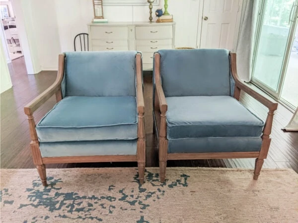 Pair of reupholstered chairs in living room.