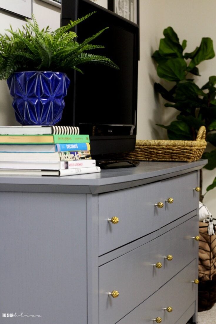 dark grey dresser with gold hardware