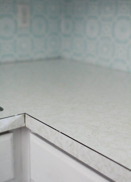 old laminate countertops - white with gold squiggles.