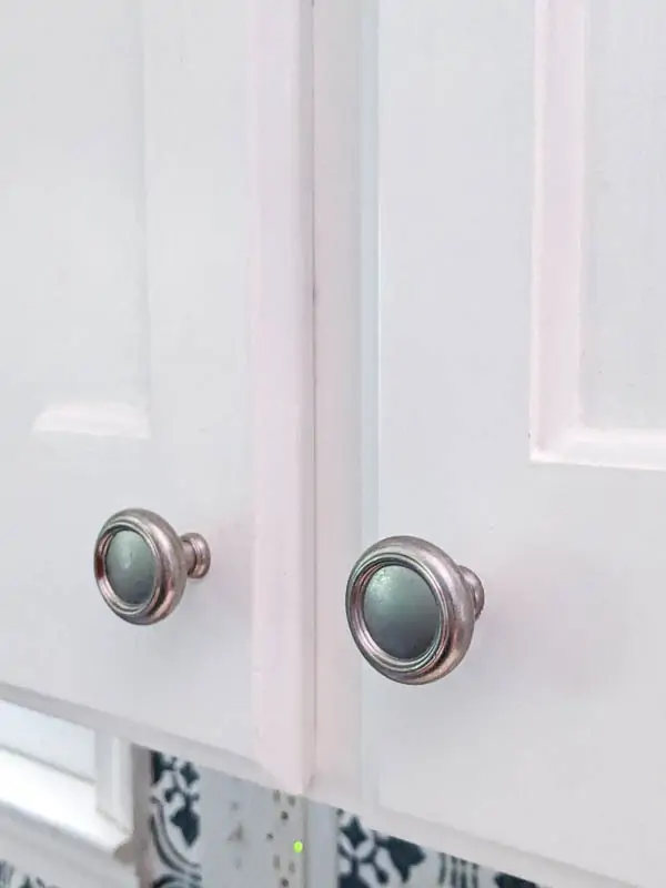 Cabinets painted white with no brush strokes showing.