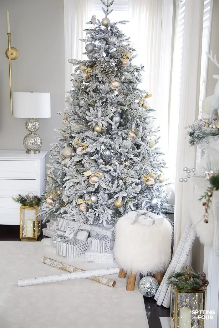 Flocked white Christmas tree with all white and silver decorations