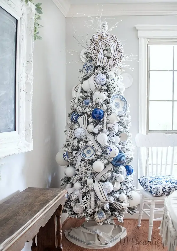 Flocked white Christmas tree with all white and silver decorations