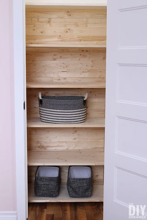 https://www.lovelyetc.com/wp-content/uploads/2022/01/natural-planked-closet-and-wood-shelving.webp