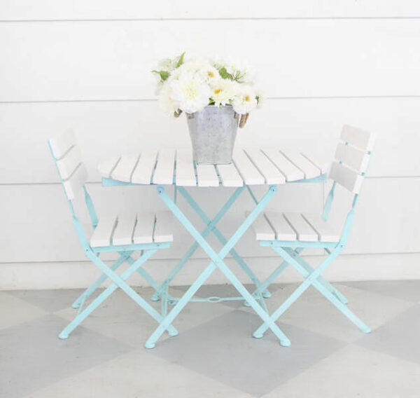 small patio table and chairs painted with spray paint.