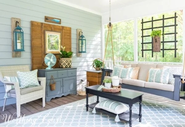 hanging swing and oversized lanterns in porch.