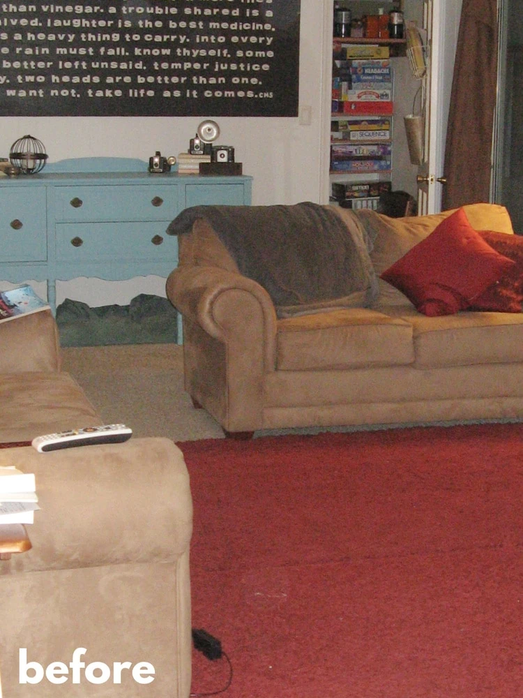 before photo of family room with red rug and tan sofas.
