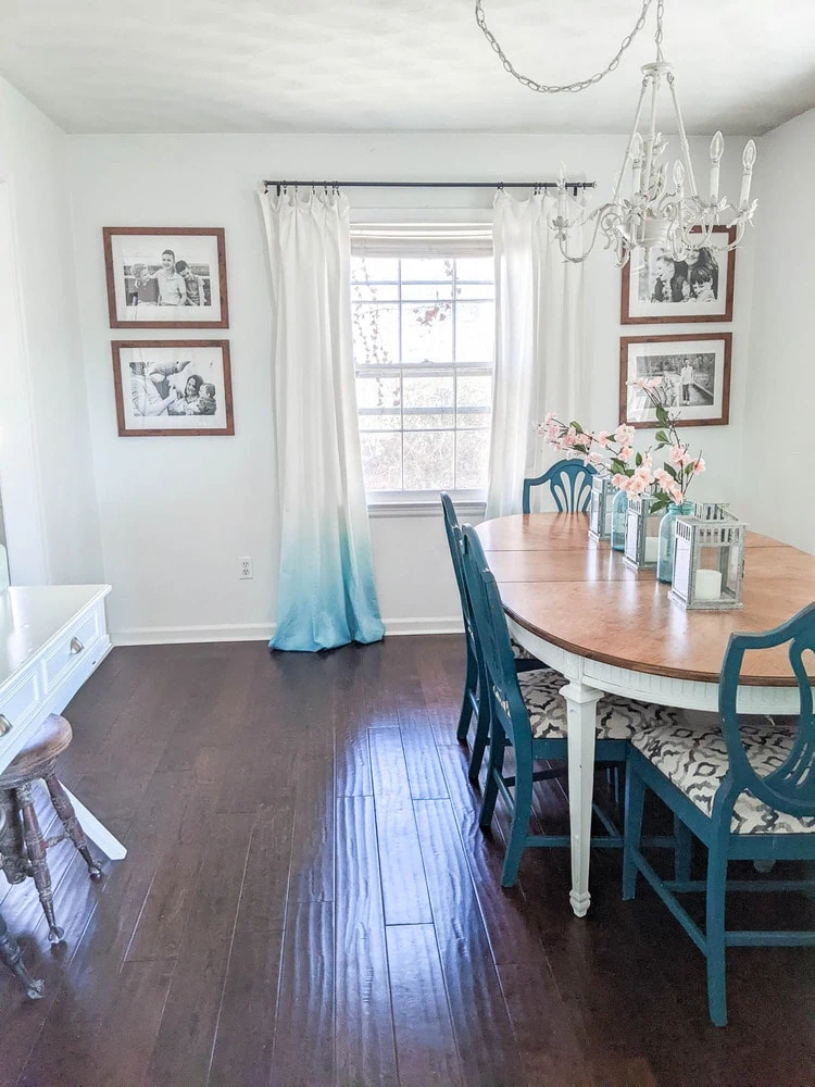 Light from the window reflecting off a dark hardwood floor.