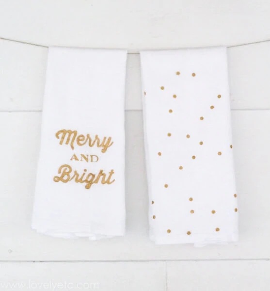 tea towels with gold dots and the words merry and bright stenciled on them. 