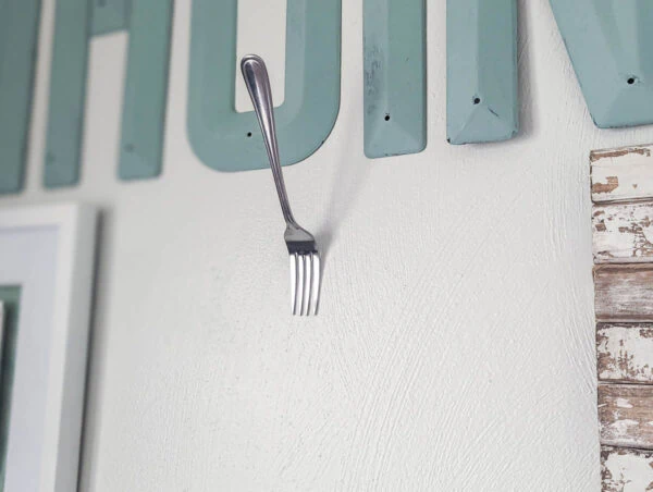 Hanging pictures on wall on sale with wire