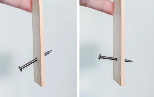 wooden paint stick with nail sticking through it facing two different angles.