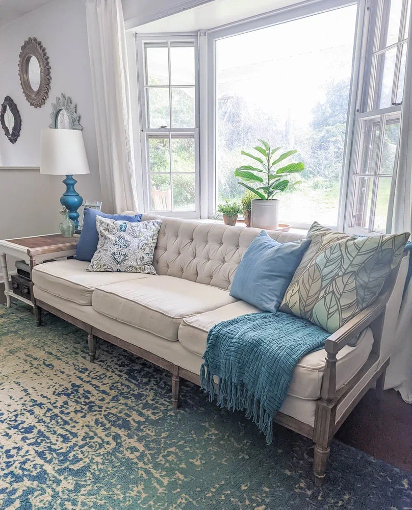 sofa reupholstered with drop cloth in living room.