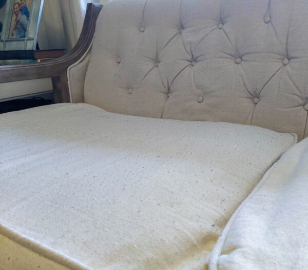 drop cloth upholstery covered in little fuzz balls.