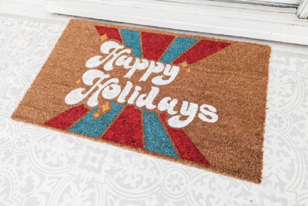 diy holiday doormat that says happy holidays.