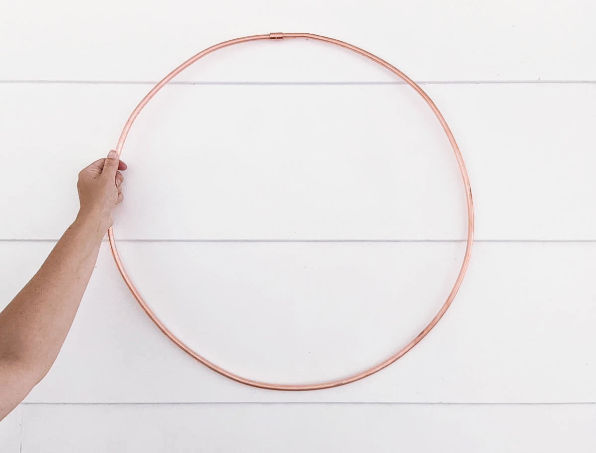copper tubing formed into a circular wreath shape.