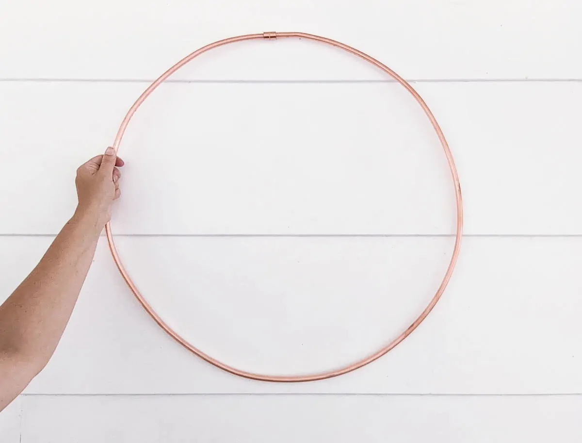 copper tubing formed into a circular wreath shape.