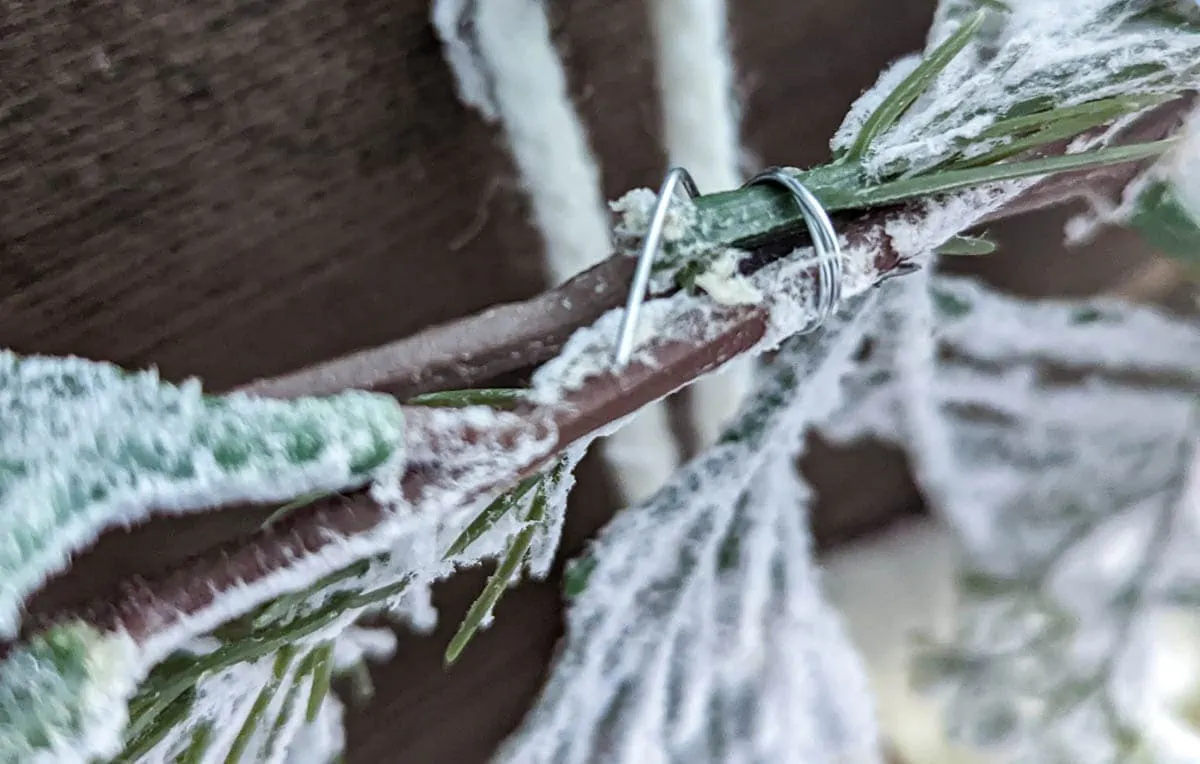 Wire wrapped around two garlands to connec them.