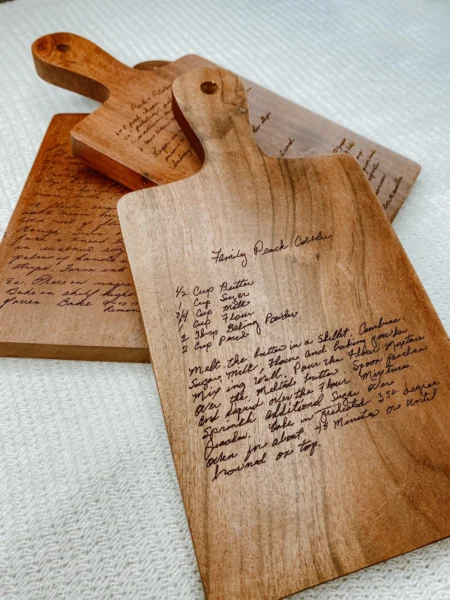 wooden cutting board with recipe engraved in it.