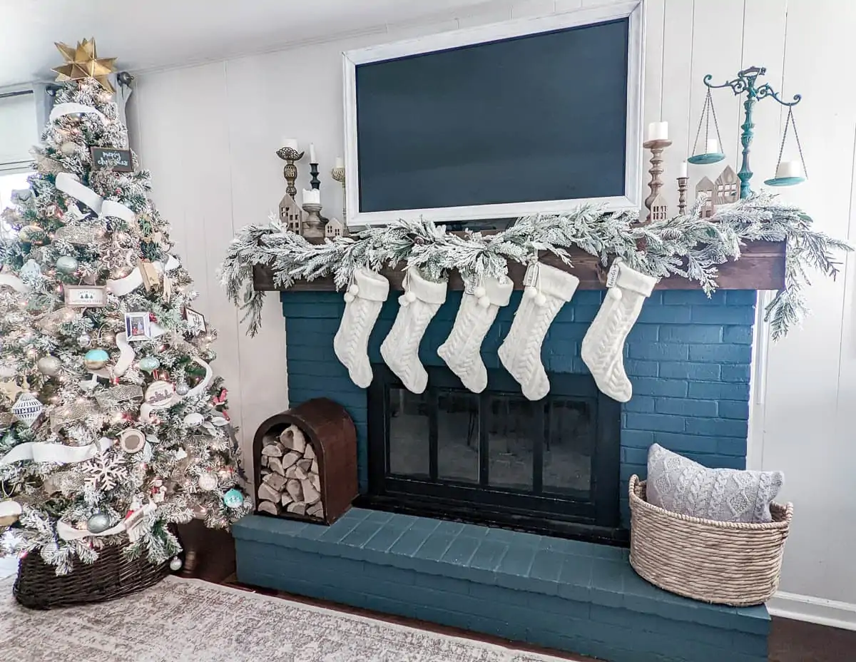 flocked garland swagged three times across Christmas mantel.