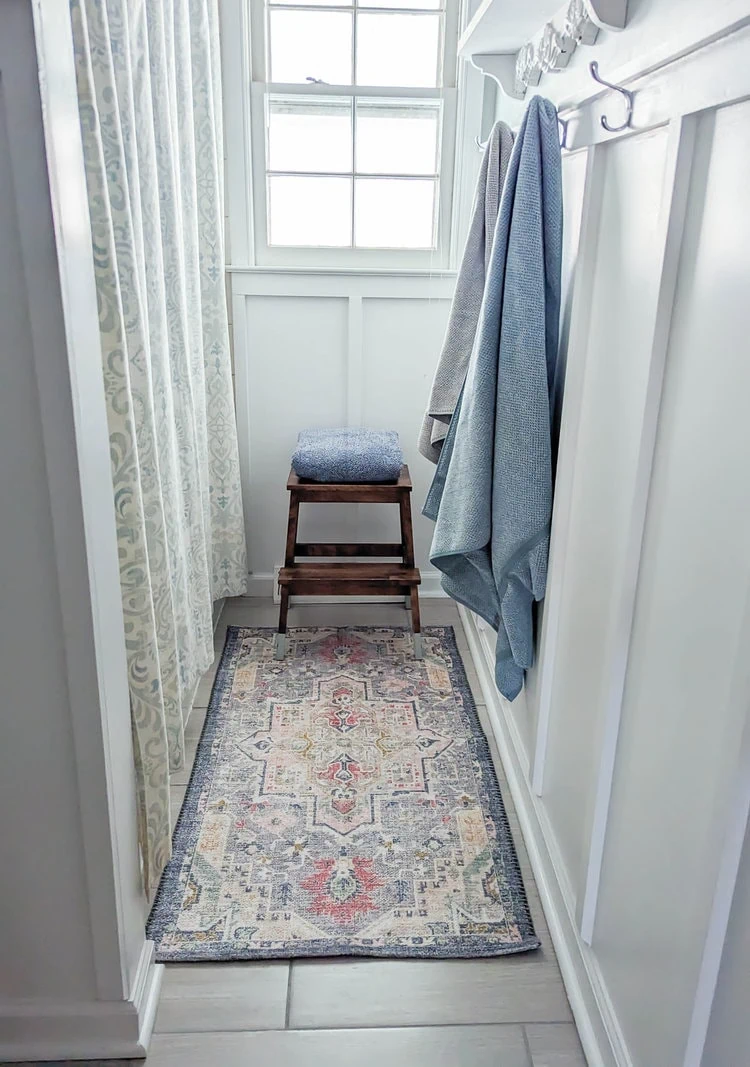 colorful rug in bathroom.