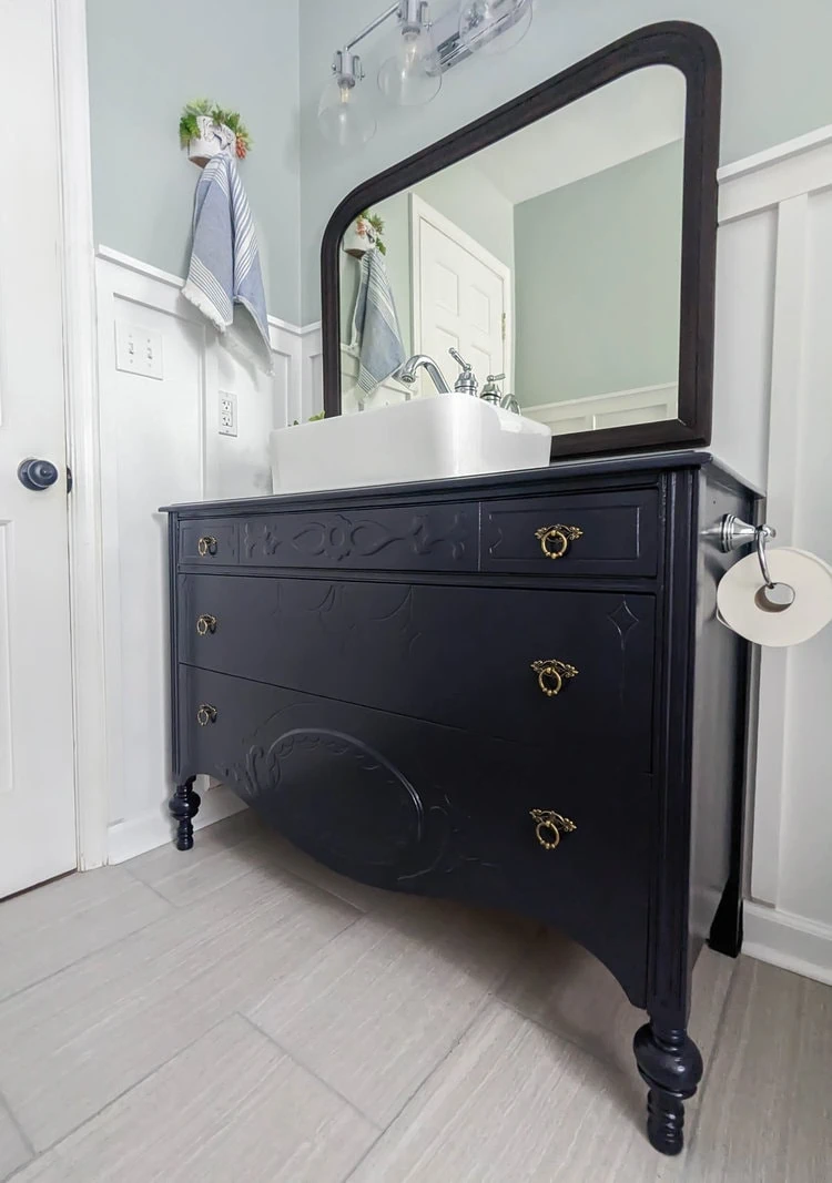 deep blue bathroom vanity with rectangular vessel sink.