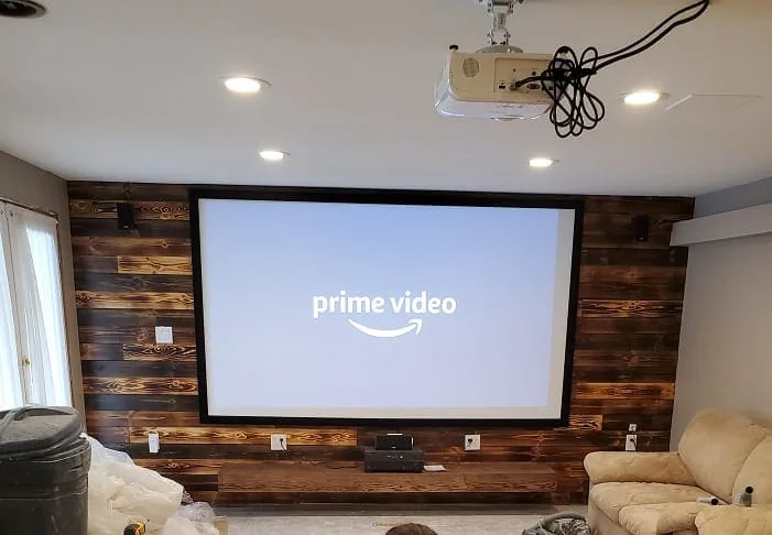 Dark wood shiplap wall with a wood burned finish.