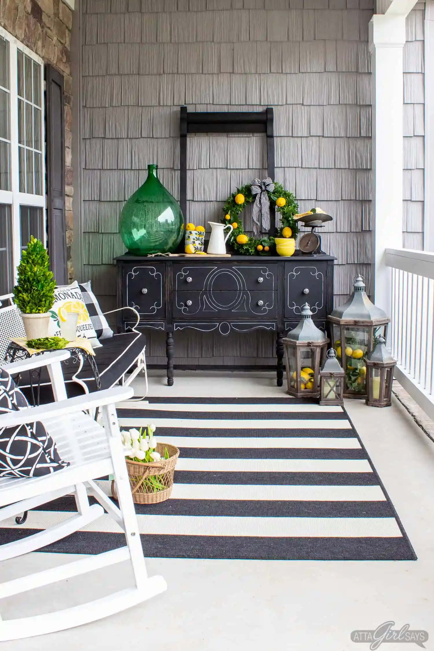 front porch with black buffet and lots of accessories.