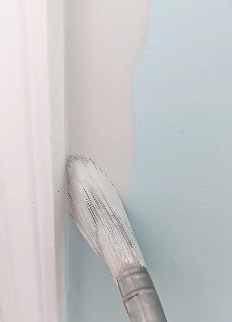 cutting in paint next to door trim.