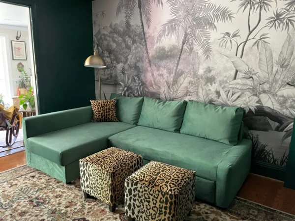 couch with green velvet slipcover.