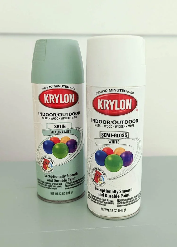 Krylon colormaxx spray paint in the colors catalina mist and white.