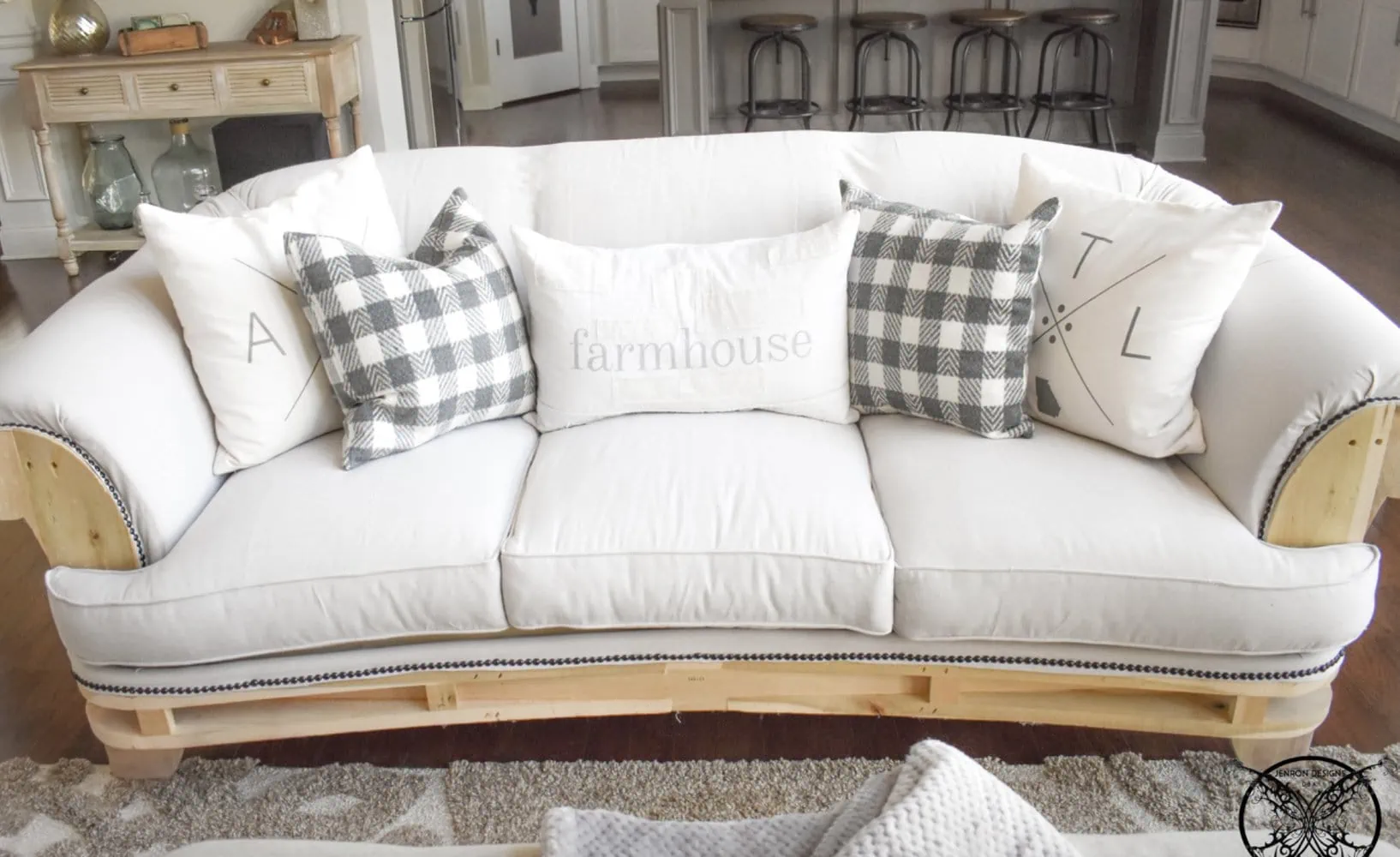 sofa deconstructed to a wood frame with drop cloth upholstery.