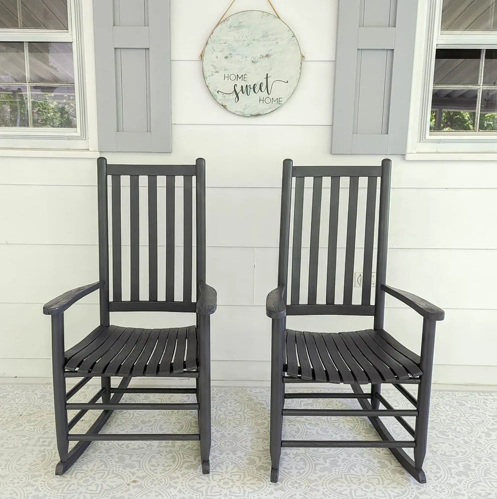 dark gray painted rocking chairs on porch.