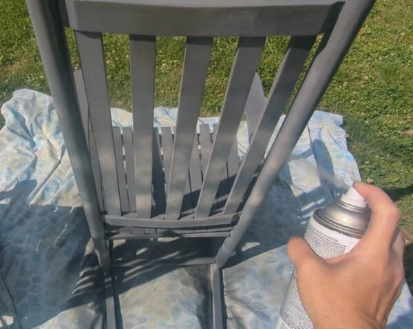 painting a chair with Rustoleum spray paint.