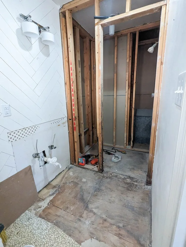 bathroom after wall is removed.