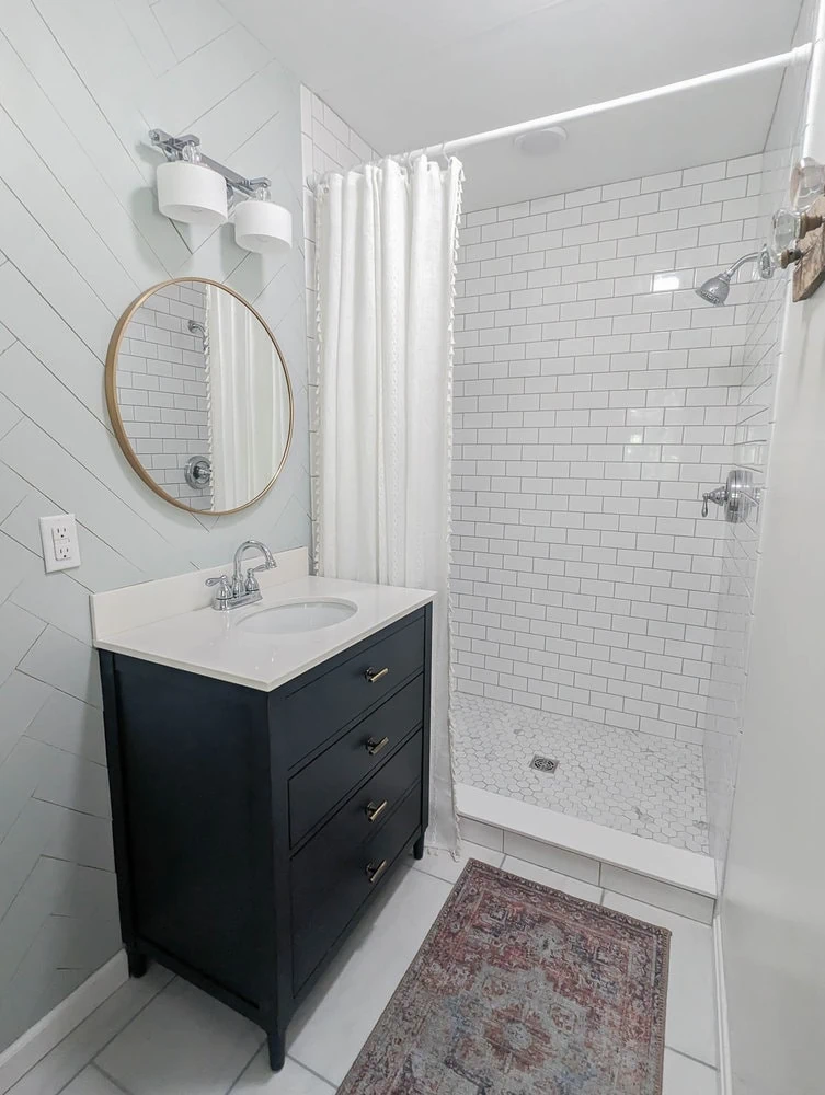 Large walk-in shower with extra long shower curtain.