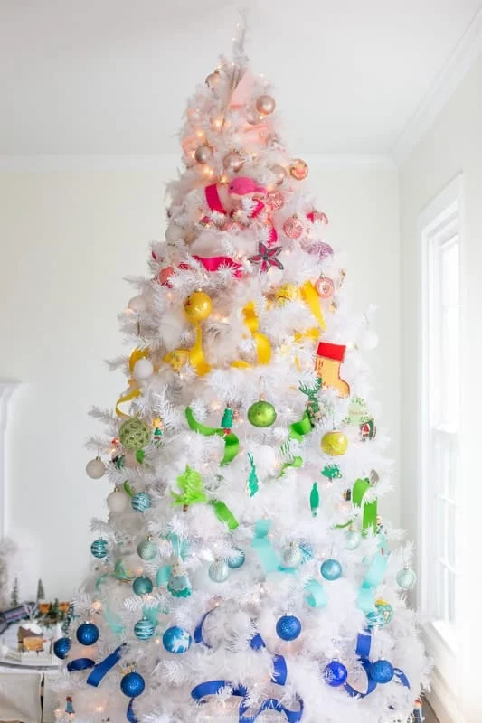 rainbow Christmas tree with rainbow ornaments and ribbon.